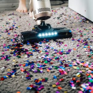 Vacuuming up confetti on carpet