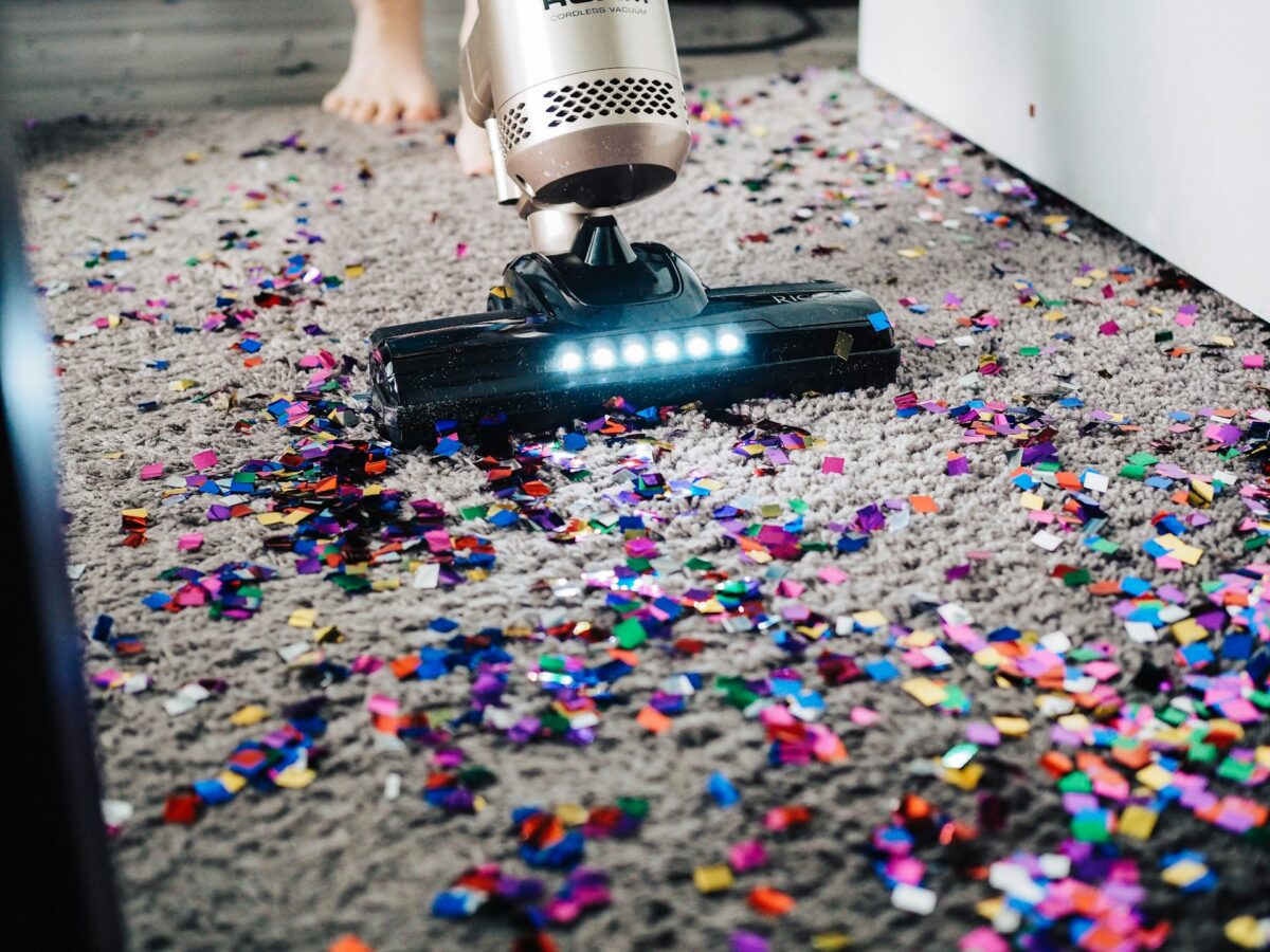 Vacuuming up confetti on carpet