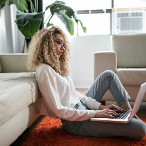 Woman on laptop in living room