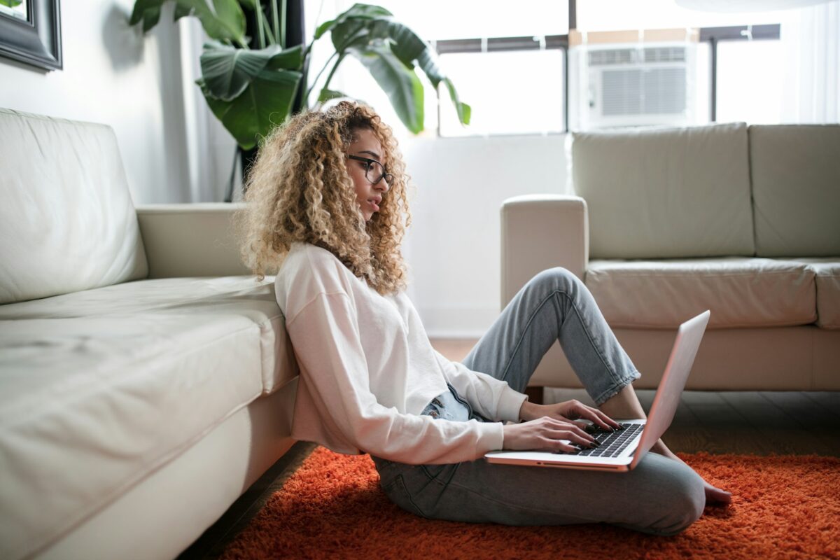 Woman on laptop in living room